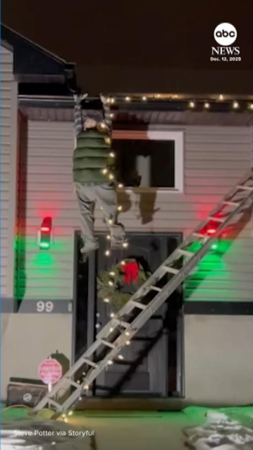 Video Concerned neighbors check on robotic Clark Griswold hanging from gutter