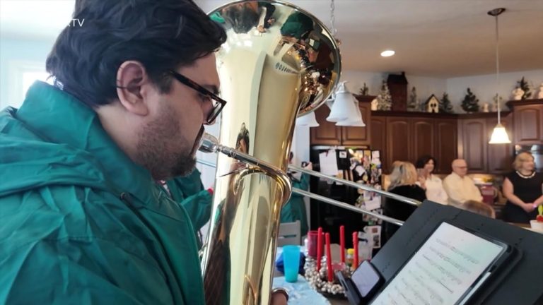 WATCH:  Indy Big Band Christmas Caroling musicians spread holiday cheer to those in need