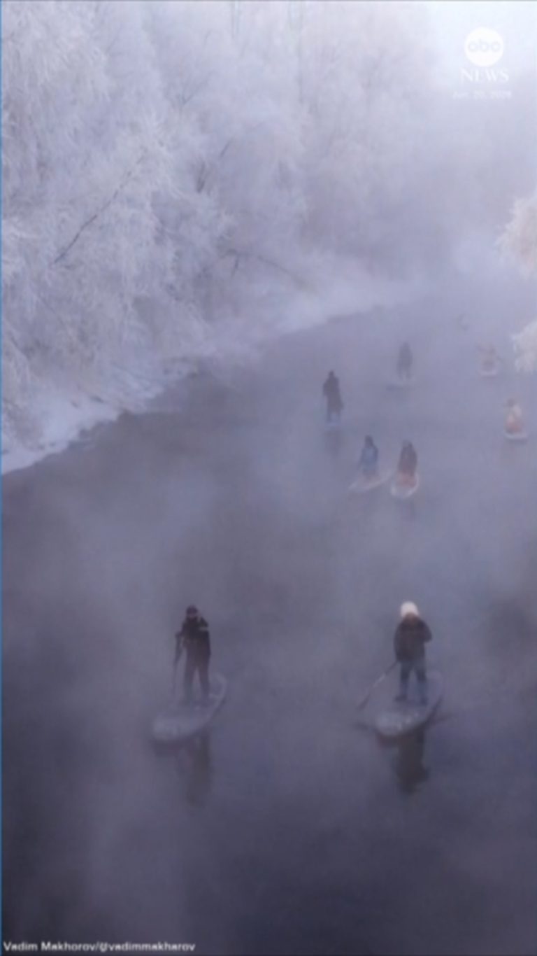 WATCH:  Paddleboarders take to river in freezing conditions