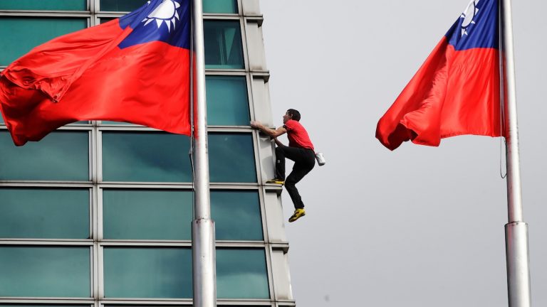 American rock climber Alex Honnold climbs Taipei 101 skyscraper without ropes